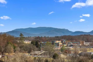 Great Smoky Mountains cabin view with scenic mountain landscape and blue sky in Sevierville
