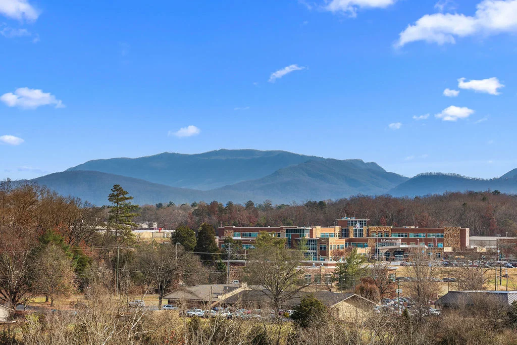 Great Smoky Mountains cabin view with scenic mountain landscape and blue sky in Sevierville