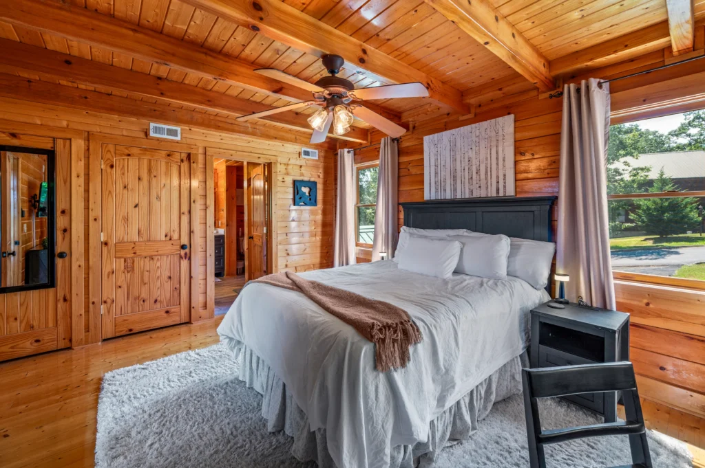 Master bedroom in 3 bedroom cabin Pigeon Forge with king bed and forest views