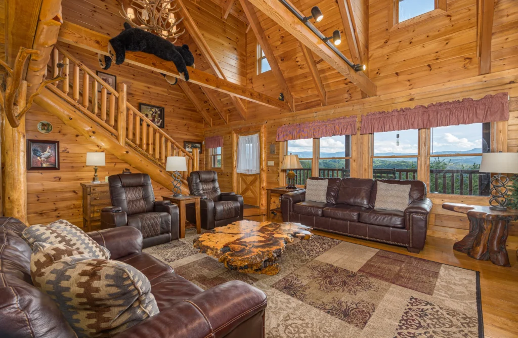 Luxury log cabin living room with vaulted timber ceilings and mountain views in Sevierville
