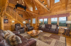 Luxury log cabin living room with vaulted timber ceilings and mountain views in Sevierville