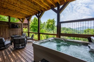 Pet-friendly cabin hot tub deck with mountain views in Pigeon Forge vacation rental