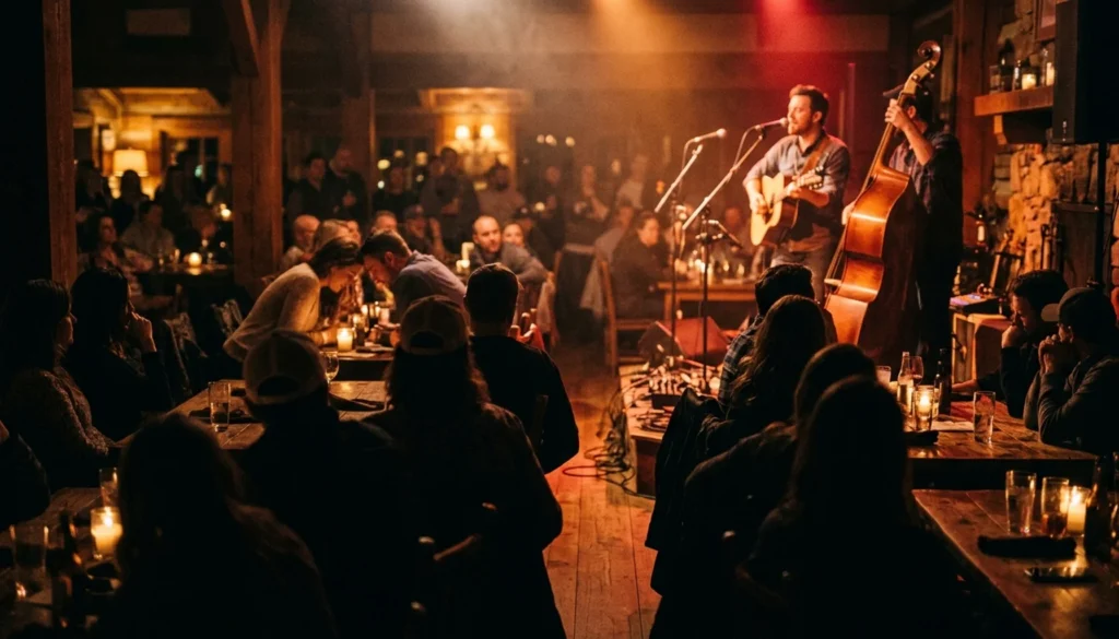Live dinner music performance at a romantic restaurant in Gatlinburg Tennessee, crowd silhouettes against warm stage lighting