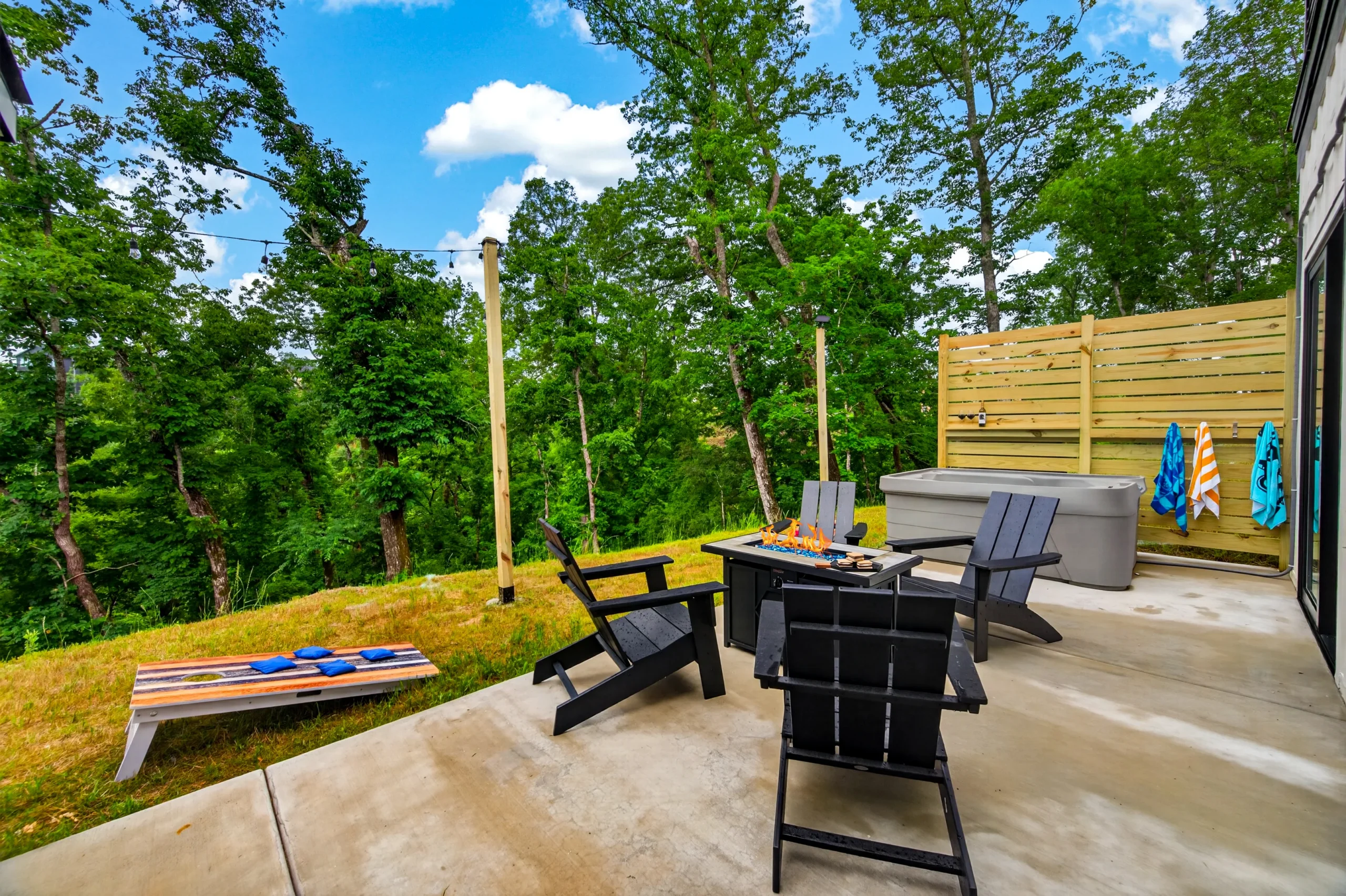1414 Social Sevierville Tennessee rooftop terrace and hot tub with Adirondack chairs and mountain views
