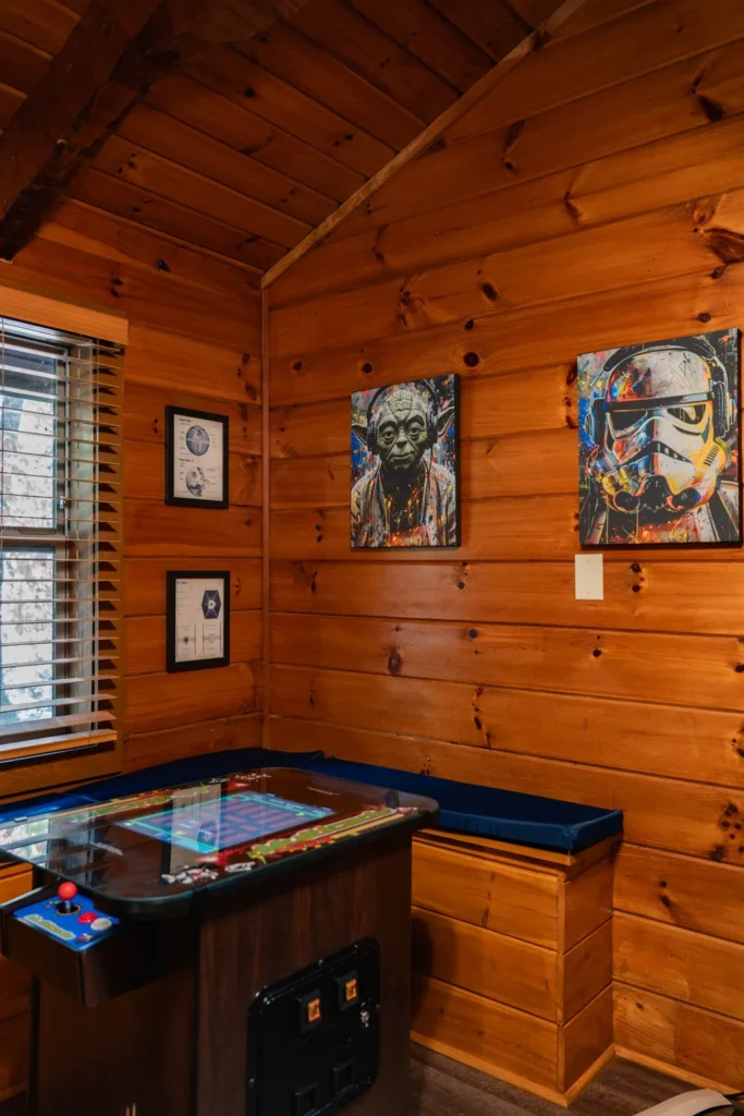 Forest Awakens game room with arcade machine and Star Wars decor in Sevierville cabin