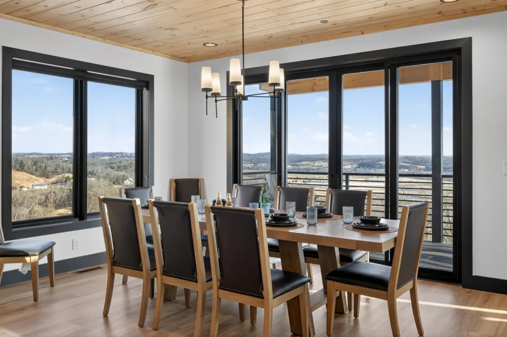 Modern dining room with valley views through floor-to-ceiling windows in Sevierville cabin