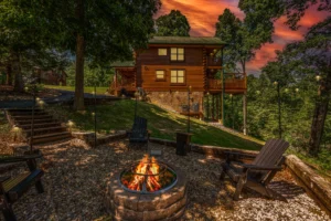 Rustic log cabin exterior with firepit and Adirondack chairs in Sevierville cabins by Dollywood