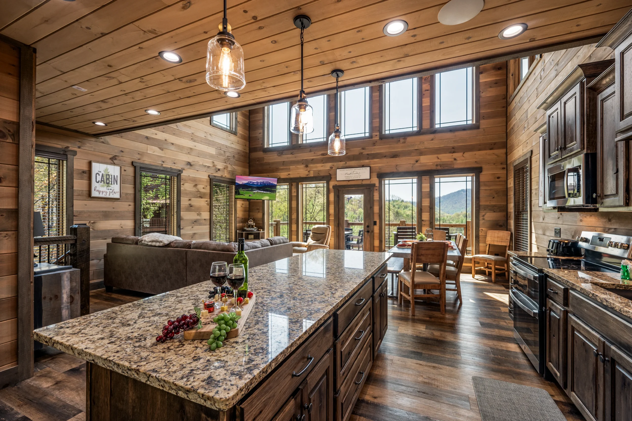 Modern log cabin kitchen with granite countertops and mountain views in Sevierville, TN