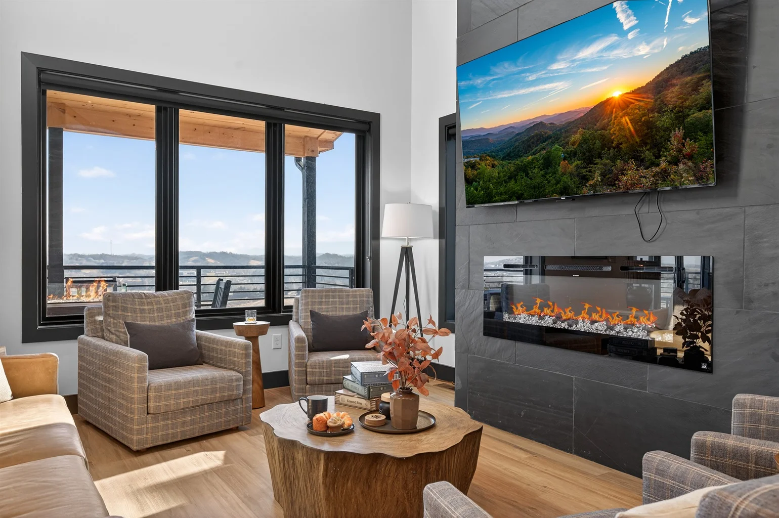 Modern luxury living room with mountain views and fireplace in Sevierville accommodation