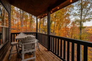 Covered deck with Adirondack chairs overlooking autumn foliage near Sevierville from Gatlinburg
