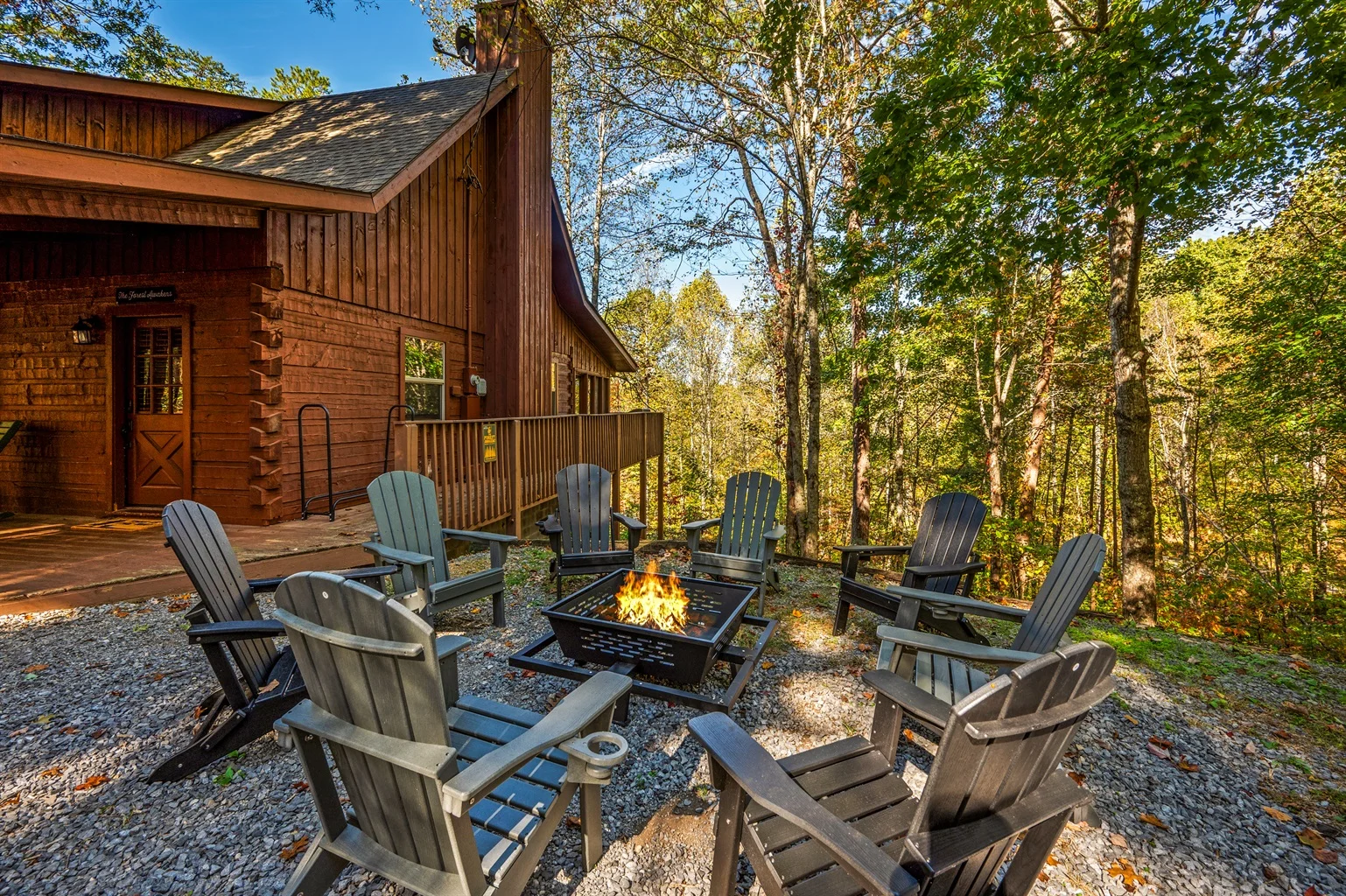 Pet friendly cabins Pigeon Forge with fire pit and Adirondack chairs for dog owners