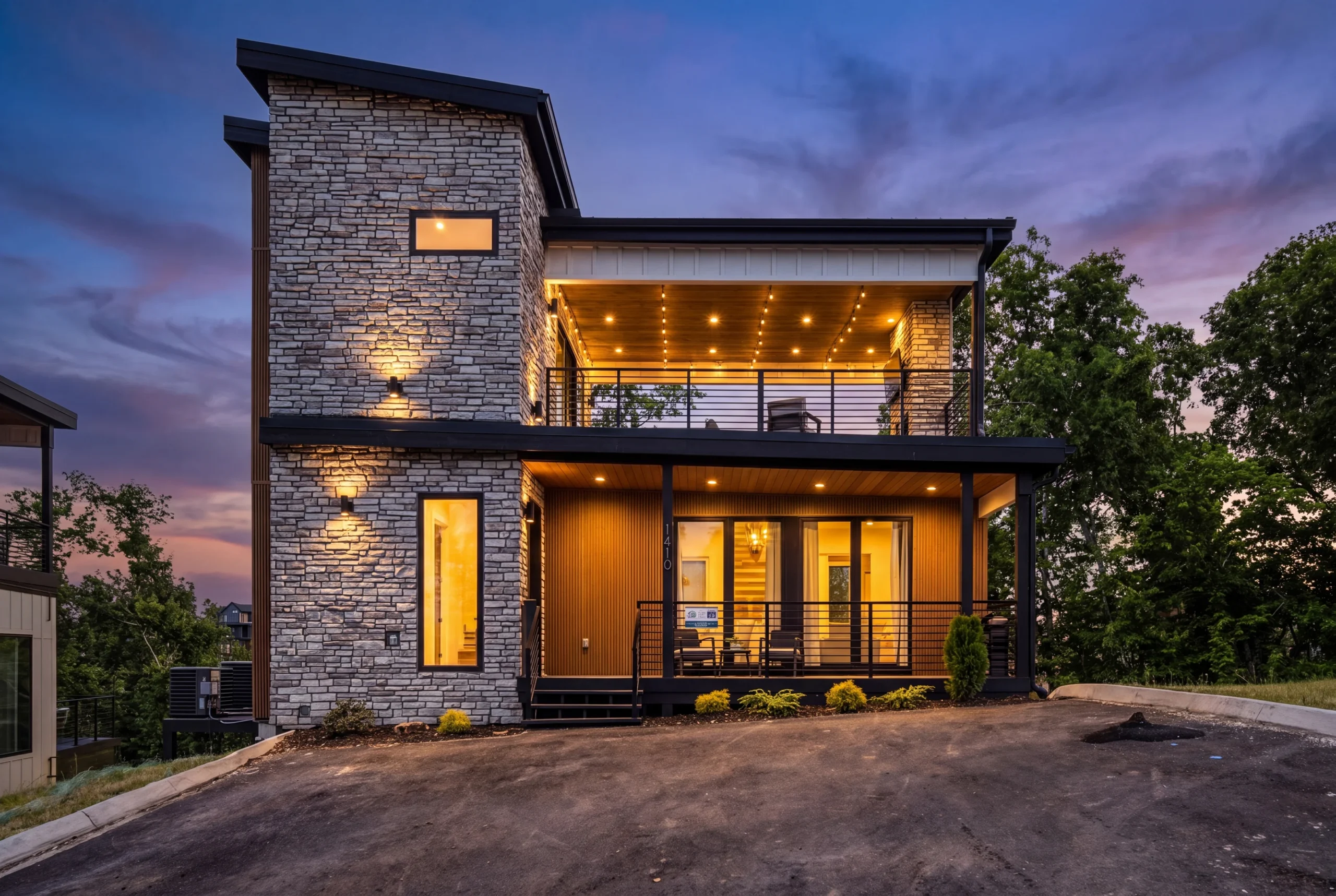 3 bedroom cabin gatlinburg area lodge exterior with stone facade at twilight