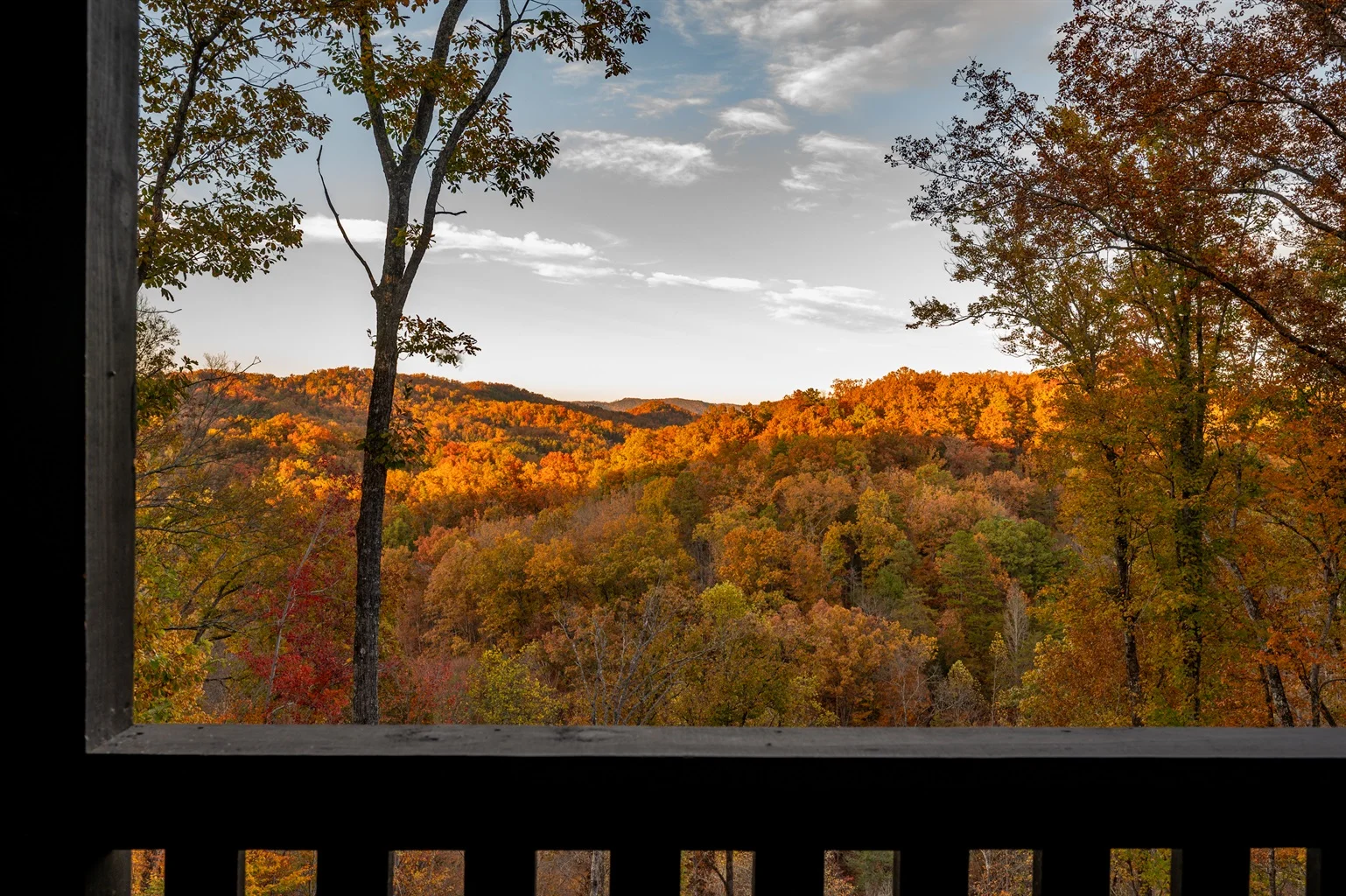 Autumn mountain vista with fall foliage viewed from a covered porch at Hemlock Hills near Sevierville
