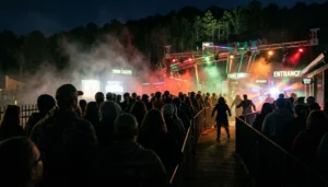 Crowd waits in haze and stage lights at Zombie Invasion at Rocky Top Mountain Coaster in Pigeon Forge